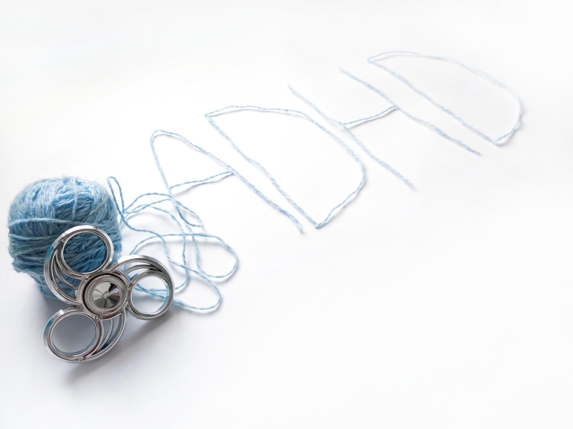 Studio table with threads and sketches