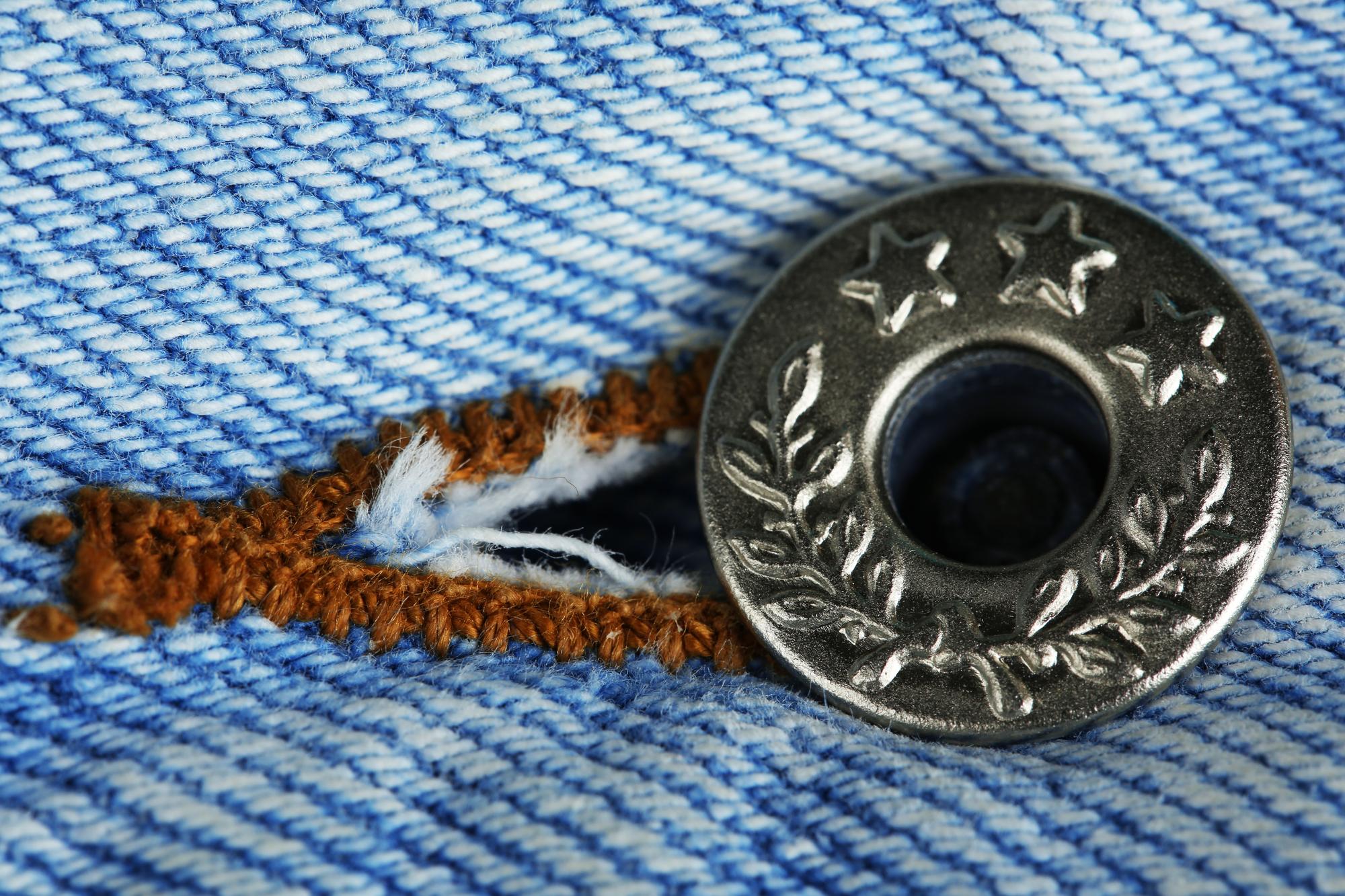 Close-up embroidered crest on denim